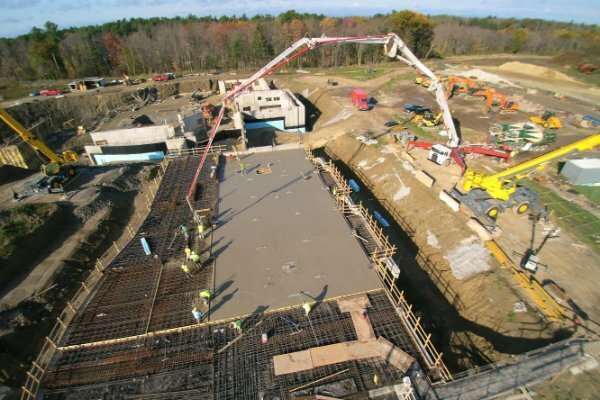 Commercial concrete pumping services for elevated slab placement in New England