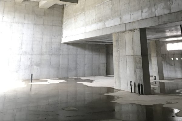Structural flatwork laser screed finishing for high-bay warehouse floor in New England